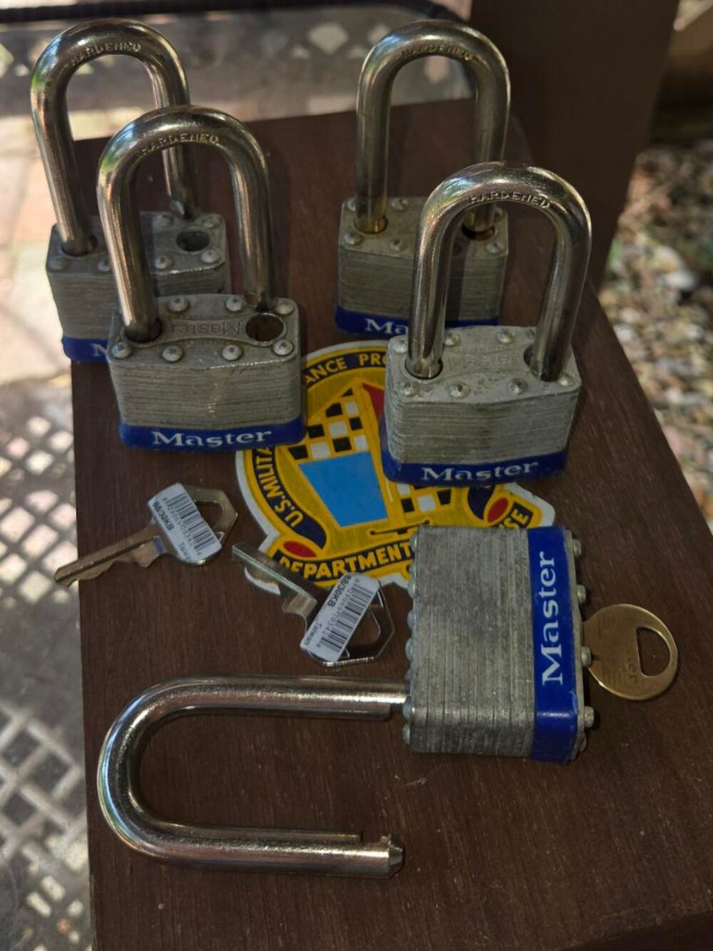 set of 4 Masterlock long shank keyed alike locks (1 original key and 2 copies)